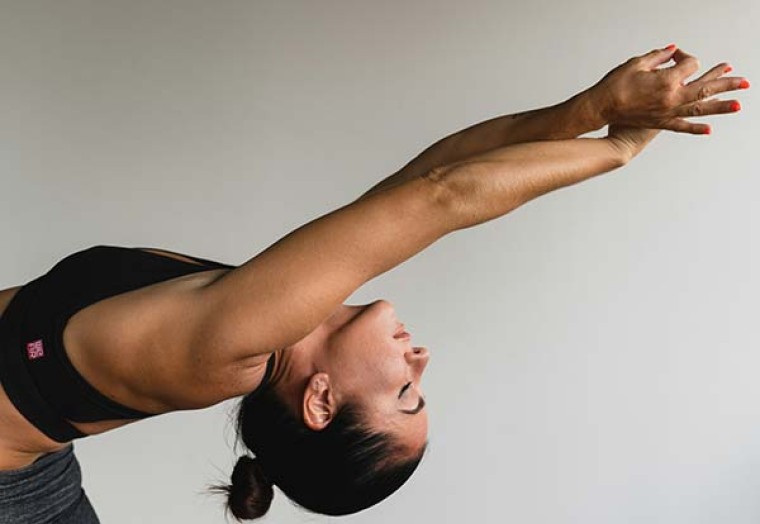 woman performing yoga pose