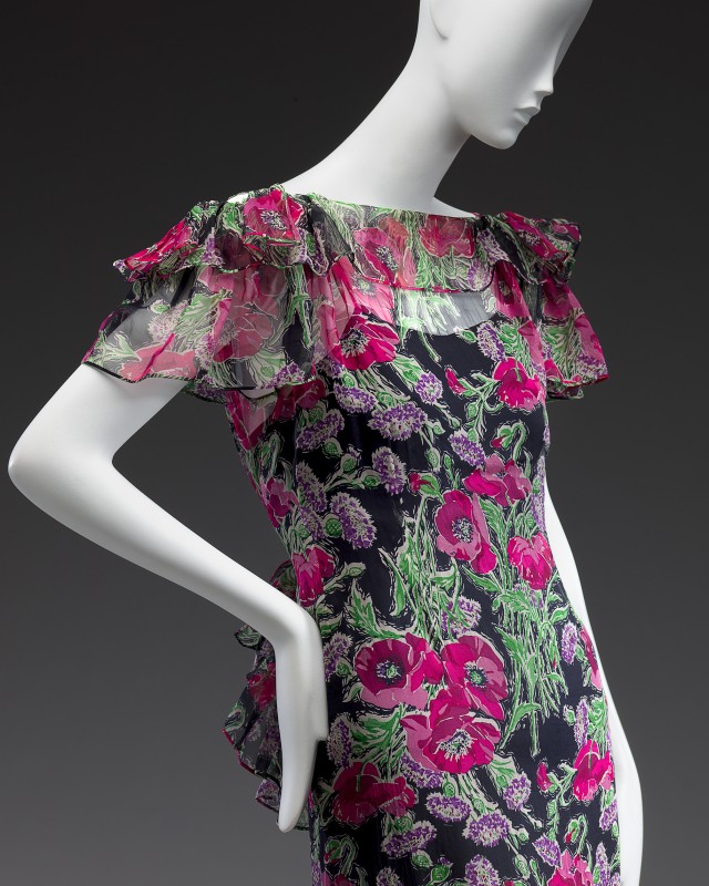 A mannequin fitted in a floral dress by designer Jean Patou